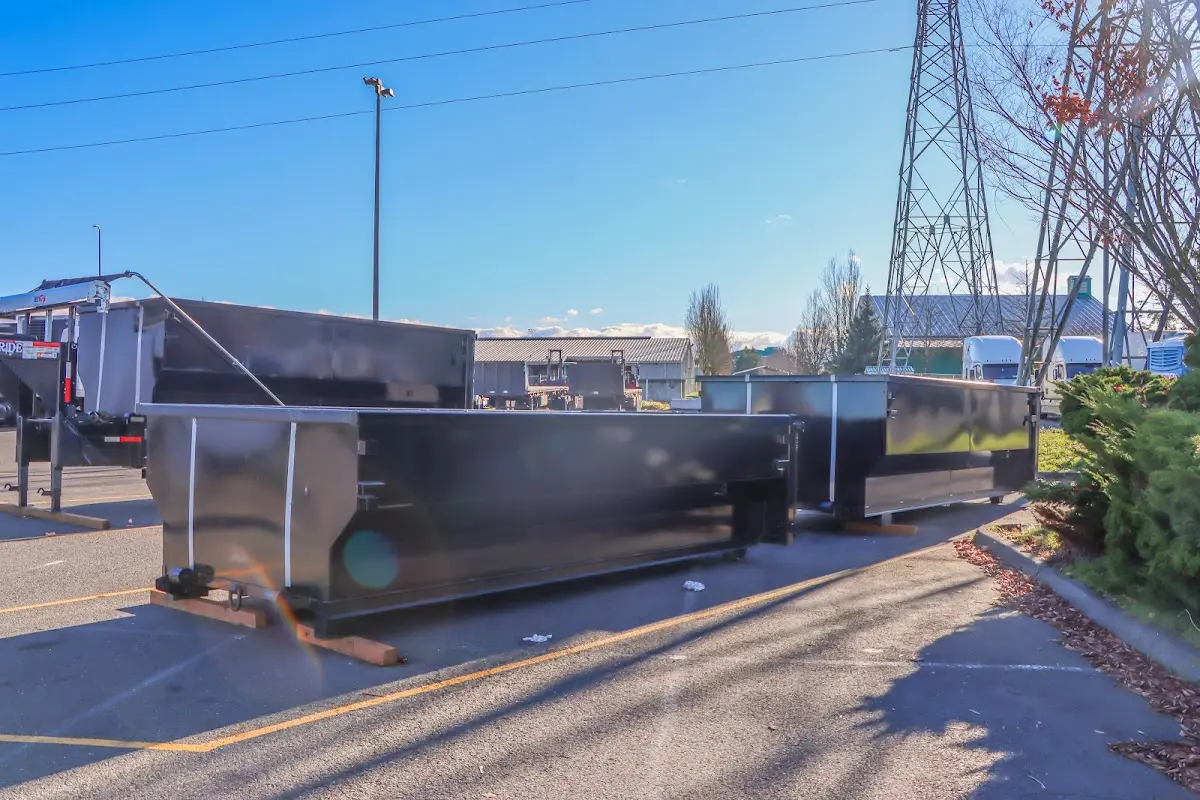 Roll-off dumpster ready for waste disposal at job site for 15 Yard Dumpster Rental in Fairview